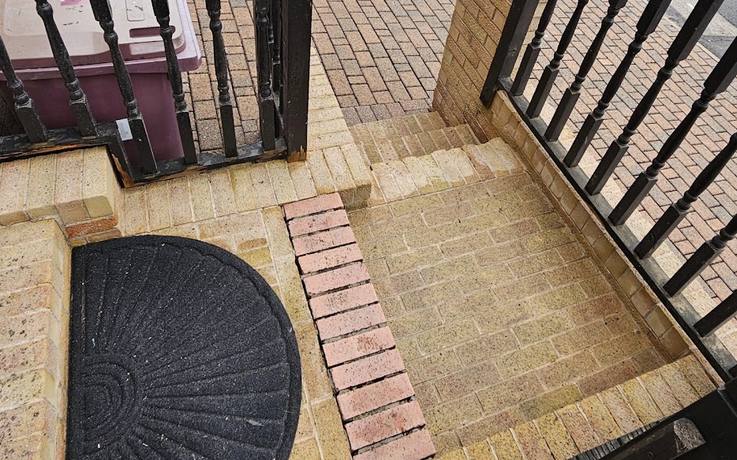 Brick paved steps and porch after cleaning