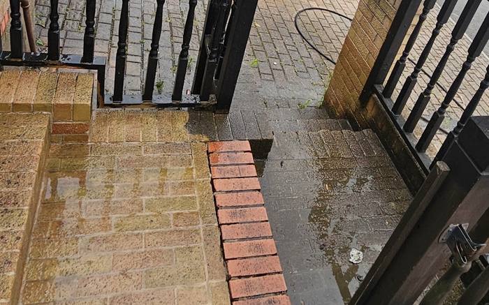 Brick paved front steps and porch dirty and slippery before cleaning