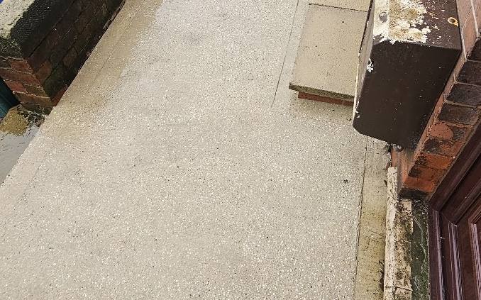 Concrete forecourt cleaned back to bare concrete
