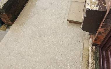 Concrete forecourt cleaned back to bare concrete