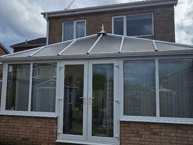 A conservatory with a polycarbonate roof cleaned down