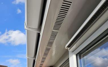 Fascia and soffit boards washed back to white