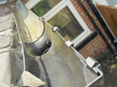 A lead box gutter cleaned out
