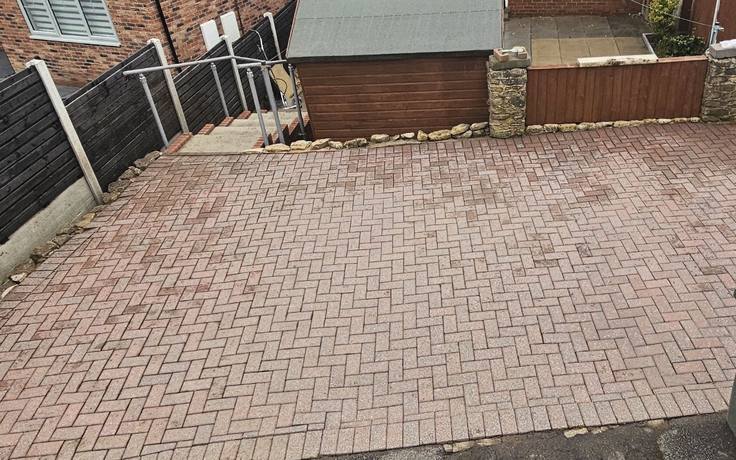 Rear yard block paving cleaned to a bright red finish