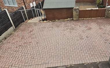 Rear yard block paving cleaned back to a bright red finish