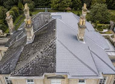 Aerial view of a large tiled roof after cleaning