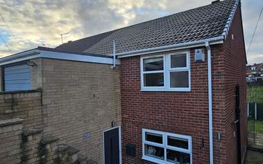 A roofline after the gutters and fascias were cleaned