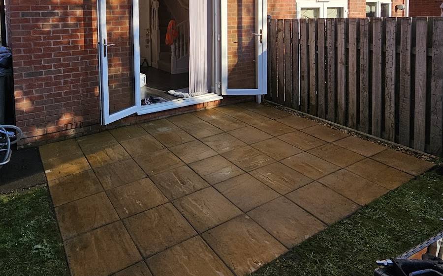 An Indian sandstone patio cleaned back to a warm buff colour