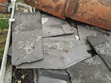 The ridge and gutter line of a slate roof