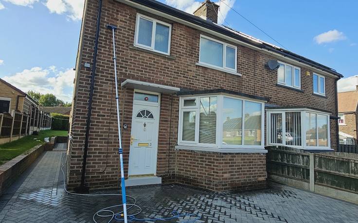 A house frontage being soft washed